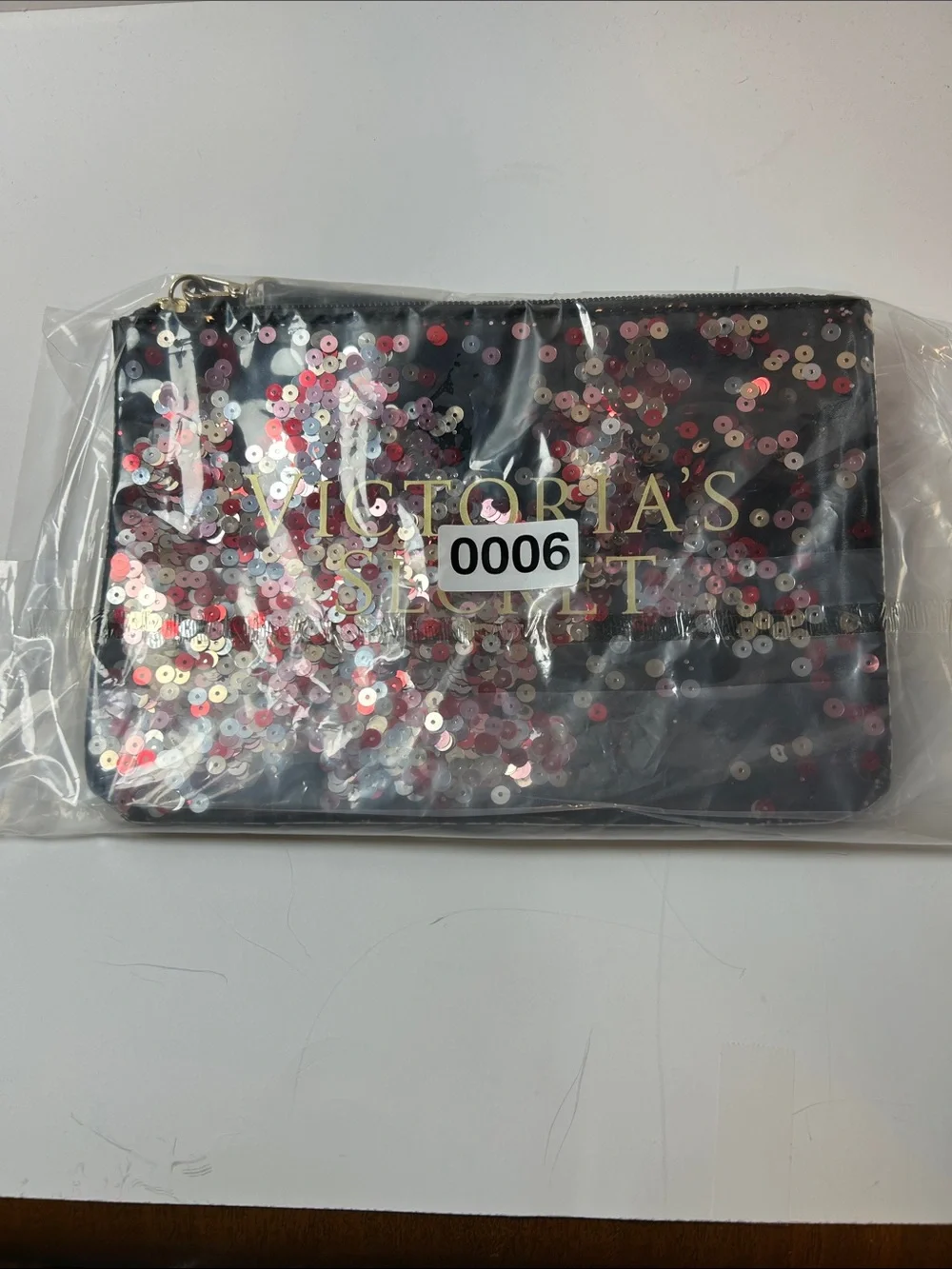 Victoria's Secret Floating Confetti Sequin Wristlet Pouch.